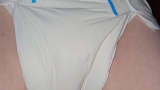 Diaper girl pees thick diaper